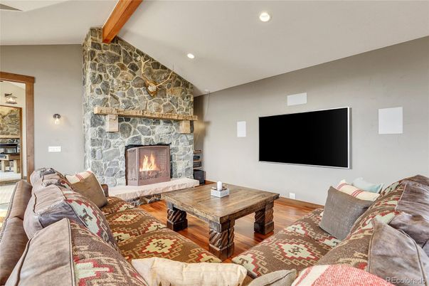 Fireplace, Interior, Living room, Recessed Lighting, Stone Walls, Wooden Beams, Wood Texture Flooring