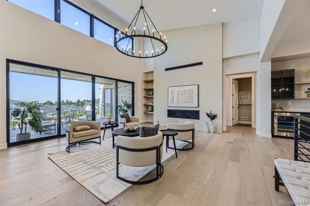 Chandelier, Fireplace, Interior, Kitchen, Living room, Pendant Lights, Recessed Lighting, Wood Texture Flooring