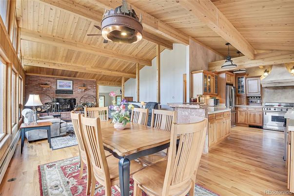 Dining room, Fireplace, Interior, Kitchen, Living room, Pendant Lights, Stainless Steel Appliances, Stone Walls, Wooden Beams, Wooden Ceilings, Wood Texture Flooring