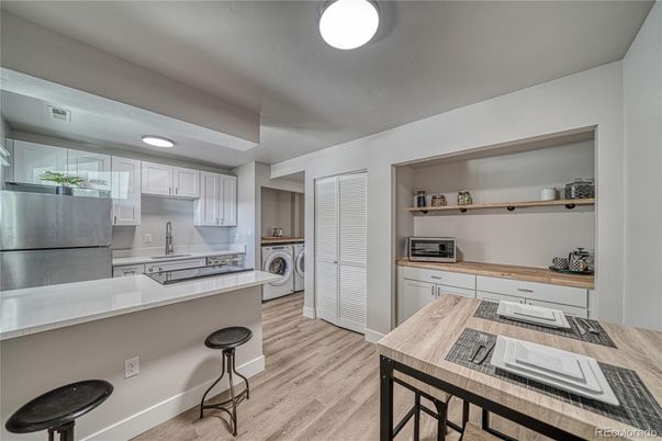 Interior, Kitchen, Recessed Lighting, Washer, Wood Texture Flooring