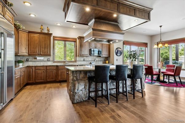 Dining room, Interior, Kitchen, Pendant Lights, Recessed Lighting, Stainless Steel Appliances, Wood Texture Flooring