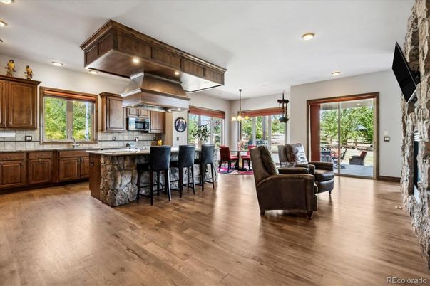 Dining room, Interior, Kitchen, Living room, Pendant Lights, Recessed Lighting, Stainless Steel Appliances, Wood Texture Flooring