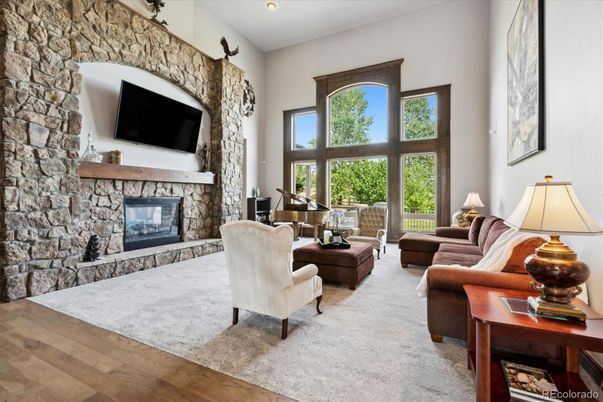 Fireplace, Interior, Living room, Recessed Lighting, Stone Walls, Wood Texture Flooring