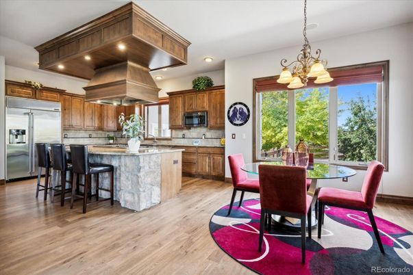 Chandelier, Dining room, Interior, Kitchen, Recessed Lighting, Stainless Steel Appliances, Wood Texture Flooring