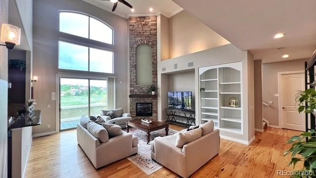 Fireplace, Interior, Living room, Recessed Lighting, Stone Walls, Wood Texture Flooring