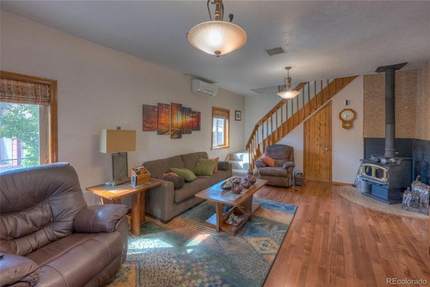 Fireplace, Interior, Living room, Pendant Lights, Stone Walls, Wood Texture Flooring