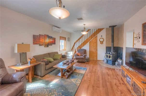 Fireplace, Interior, Living room, Pendant Lights, Stone Walls, Wood Texture Flooring