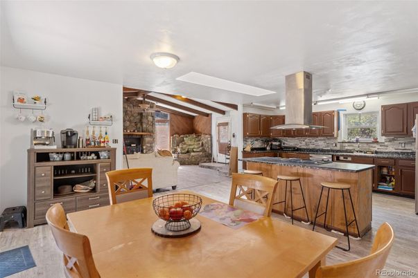 Dining room, Fireplace, Interior, Kitchen, Living room, Stone Walls, Wood Texture Flooring