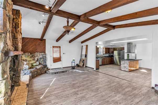 Fireplace, Interior, Kitchen, Stainless Steel Appliances, Stone Walls, Wooden Beams, Wood Texture Flooring
