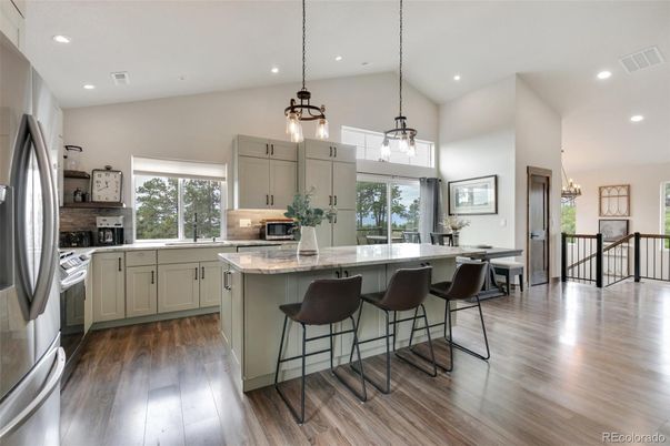 Chandelier, Interior, Kitchen, Pendant Lights, Recessed Lighting, Stainless Steel Appliances, Wood Texture Flooring