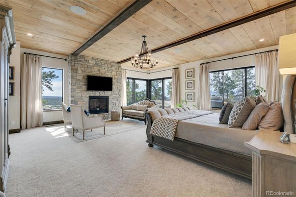 Bedroom, Chandelier, Fireplace, Interior, Recessed Lighting, Stone Walls, Wooden Beams, Wooden Ceilings