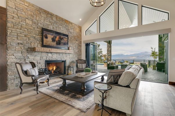 Fireplace, Interior, Living room, Recessed Lighting, Stone Walls, Wood Texture Flooring