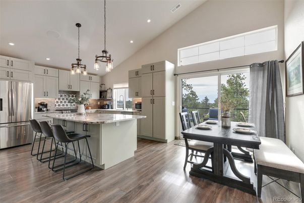 Dining room, Interior, Kitchen, Pendant Lights, Recessed Lighting, Stainless Steel Appliances, Wood Texture Flooring
