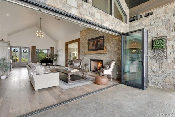 Fireplace, Interior, Living room, Pendant Lights, Piano, Recessed Lighting, Stone Walls, Wood Texture Flooring