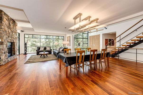 Dining room, Fireplace, Interior, Living room, Pendant Lights, Recessed Lighting, Stone Walls, Wood Texture Flooring