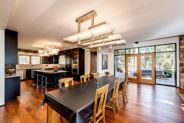 Chandelier, Dining room, Interior, Kitchen, Recessed Lighting, Stainless Steel Appliances, Wood Texture Flooring