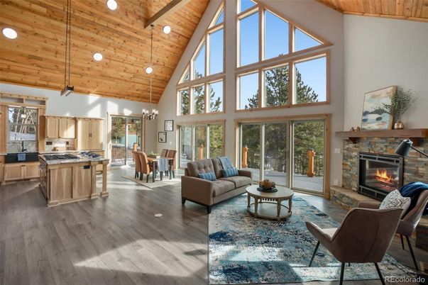 Chandelier, Dining room, Fireplace, Interior, Kitchen, Living room, Pendant Lights, Recessed Lighting, Wooden Beams, Wooden Ceilings, Wood Texture Flooring