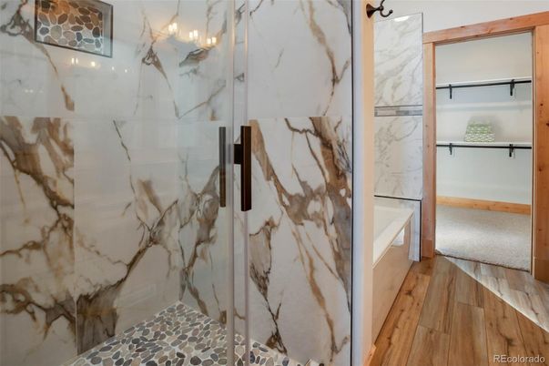 Bathroom, Glass Shower, Interior, Marble Walls, Wood Texture Flooring