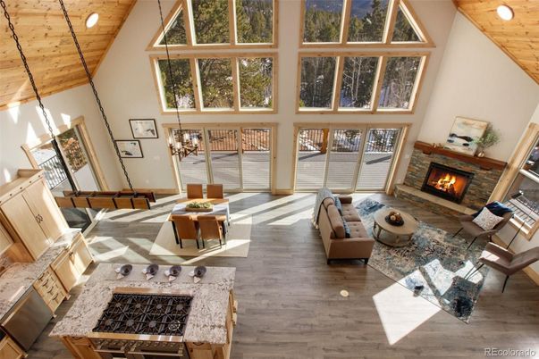 Chandelier, Dining room, Fireplace, Interior, Living room, Recessed Lighting, Wooden Ceilings, Wood Texture Flooring
