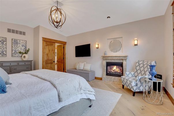 Bedroom, Fireplace, Interior, Pendant Lights, Recessed Lighting, Wood Texture Flooring