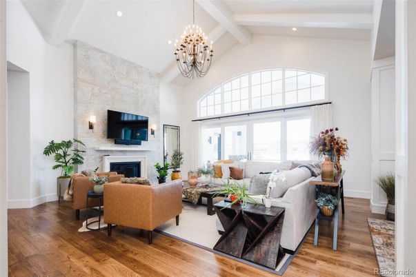 Chandelier, Fireplace, Interior, Living room, Recessed Lighting, Stone Walls, Wood Texture Flooring
