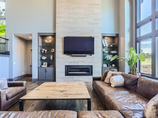 Fireplace, Interior, Living room, Recessed Lighting, Stone Walls, Wood Texture Flooring