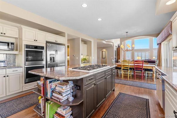 Chandelier, Dining room, Interior, Kitchen, Recessed Lighting, Stainless Steel Appliances, Wood Texture Flooring
