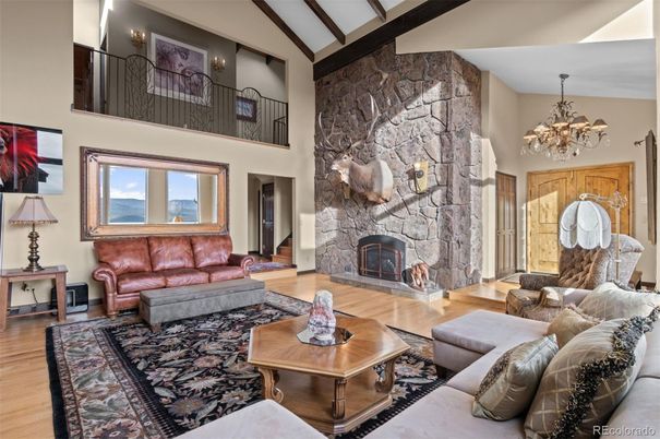 Chandelier, Fireplace, Interior, Living room, Stone Walls, Wood Texture Flooring