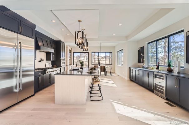 Chandelier, Dining room, Interior, Kitchen, Pendant Lights, Recessed Lighting, Stainless Steel Appliances, Wood Texture Flooring