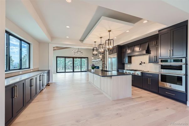 Chandelier, Interior, Kitchen, Pendant Lights, Recessed Lighting, Stainless Steel Appliances, Wood Texture Flooring