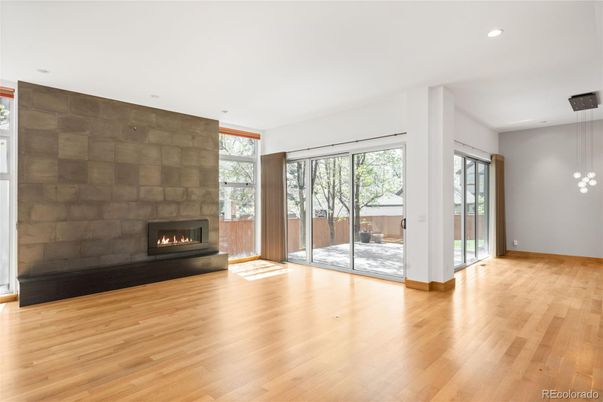 Empty room, Fireplace, Interior, Pendant Lights, Recessed Lighting, Wood Texture Flooring