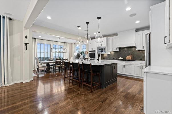 Chandelier, Dining room, Interior, Kitchen, Pendant Lights, Recessed Lighting, Stainless Steel Appliances, Wood Texture Flooring