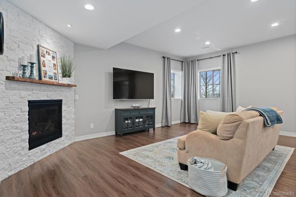 Fireplace, Interior, Living room, Recessed Lighting, Stone Walls, Wood Texture Flooring