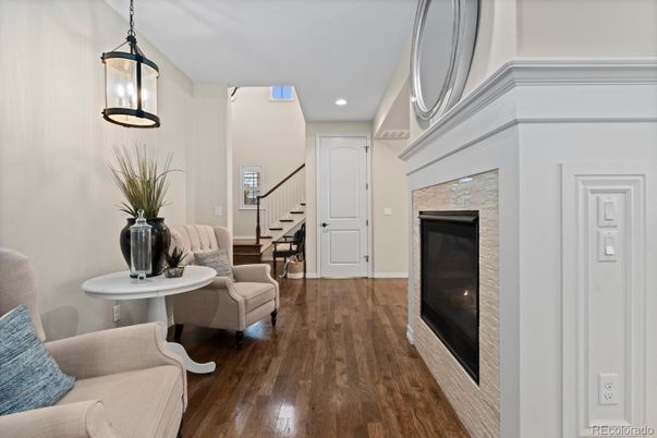 Fireplace, Interior, Pendant Lights, Recessed Lighting, Wood Texture Flooring