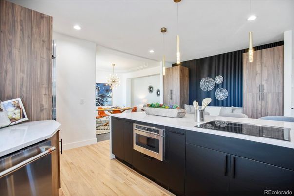Chandelier, Dining room, Interior, Kitchen, Pendant Lights, Recessed Lighting, Stainless Steel Appliances, Wood Texture Flooring