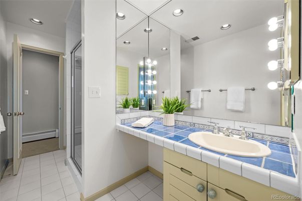 Bathroom, Dual Sink Vanities, Interior, Pendant Lights, Recessed Lighting, Tile Countertops