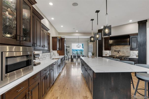 Dining room, Interior, Kitchen, Pendant Lights, Recessed Lighting, Stainless Steel Appliances, Wood Texture Flooring
