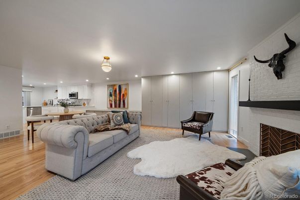 Fireplace, Interior, Kitchen, Living room, Recessed Lighting, Stainless Steel Appliances, Wood Texture Flooring