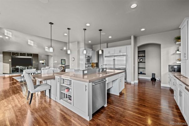 Dining room, Interior, Kitchen, Pendant Lights, Recessed Lighting, Stainless Steel Appliances, Wood Texture Flooring