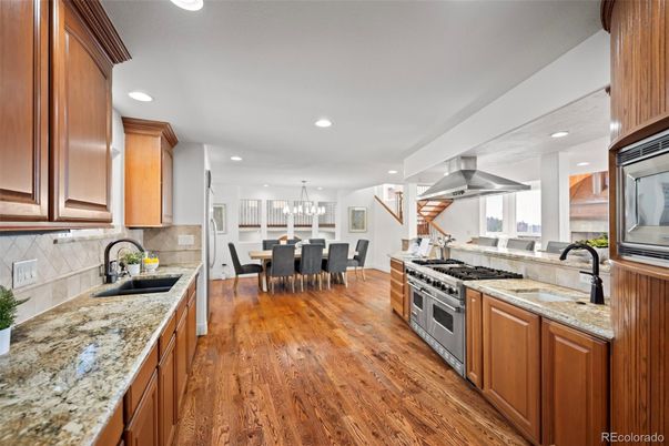 Chandelier, Dining room, Interior, Kitchen, Pendant Lights, Recessed Lighting, Stainless Steel Appliances, Wood Texture Flooring