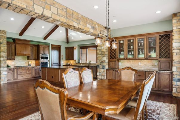 Dining room, Interior, Kitchen, Pendant Lights, Recessed Lighting, Stainless Steel Appliances, Stone Walls, Wooden Beams, Wood Texture Flooring