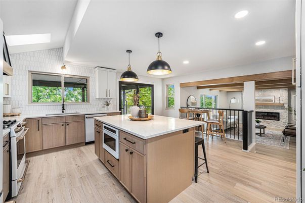 Dining room, Fireplace, Interior, Kitchen, Pendant Lights, Recessed Lighting, Stainless Steel Appliances, Wood Texture Flooring