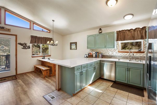 Chandelier, Dining room, Interior, Kitchen, Stainless Steel Appliances, Wood Texture Flooring