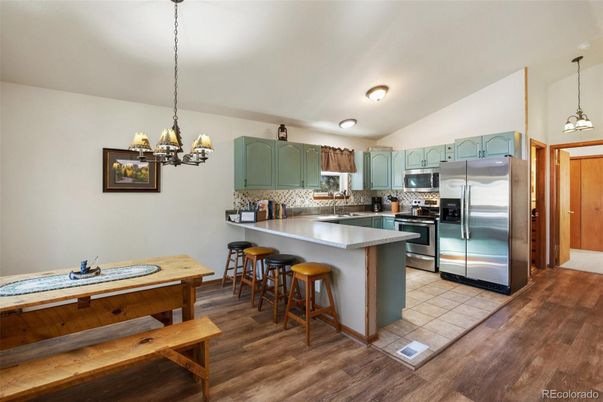 Chandelier, Interior, Kitchen, Pendant Lights, Stainless Steel Appliances, Wood Texture Flooring