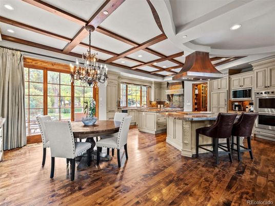 Chandelier, Dining room, Interior, Kitchen, Recessed Lighting, Stainless Steel Appliances, Wooden Beams, Wood Texture Flooring