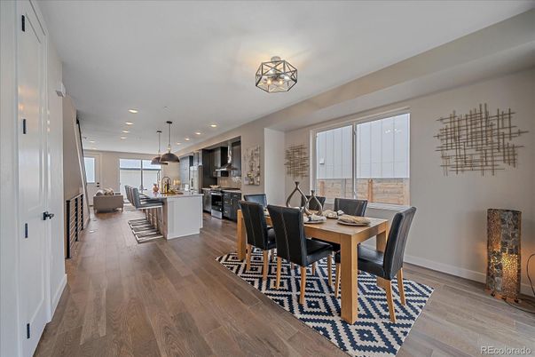 Dining room, Interior, Kitchen, Pendant Lights, Recessed Lighting, Stainless Steel Appliances, Wood Texture Flooring