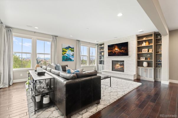 Fireplace, Interior, Living room, Recessed Lighting, Stone Walls, Wood Texture Flooring
