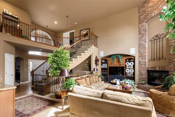 Fireplace, Interior, Living room, Pendant Lights, Recessed Lighting, Stone Walls, Wood Texture Flooring