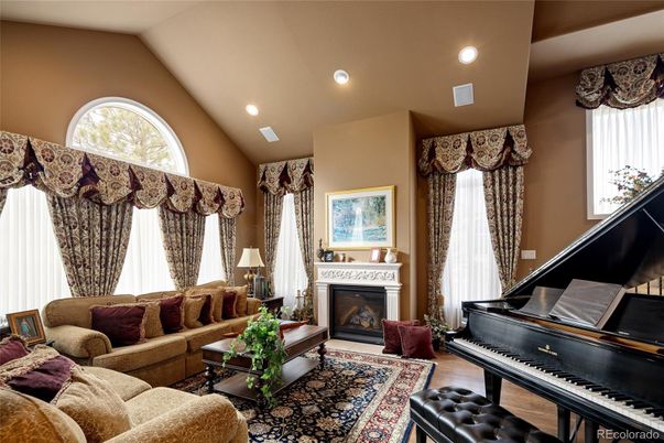 Fireplace, Interior, Living room, Piano, Recessed Lighting, Wood Texture Flooring