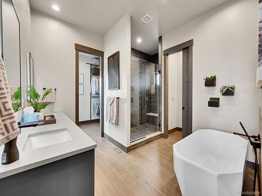 Bathroom, Dual Sink Vanities, Free Standing Baths, Glass Shower, Interior, Recessed Lighting, Wood Texture Flooring